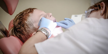 dentist examining a child's mouth